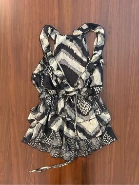 Flirty Double Zero ruffle peplum top in a black, white, and grey abstract print